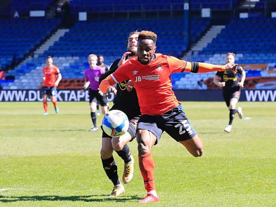 Kazenga LuaLua is fouled by Watford defender Kiko Femenia
