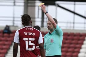 Peter Kioso is booked for Northampton against Blackpool