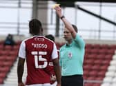 Peter Kioso is booked for Northampton against Blackpool