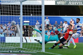 James Collins scores for the Hatters in their 3-2 defeat at QPR last season