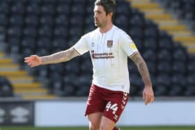 Former Luton defender Alan Sheehan in action for Northampton