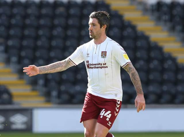 Former Luton defender Alan Sheehan in action for Northampton