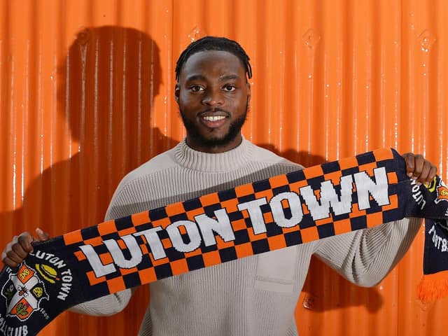 Fred Onyedinma signs for the Hatters