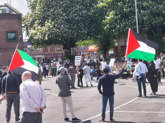 The protest took place outside Crescent Hall in Bury Park