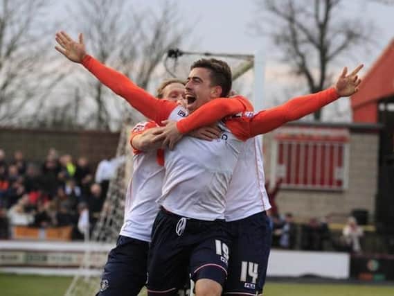Olly Lee celebrates scoring for the Hatters