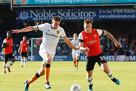Reece Burke goes up against former Luton striker James Collins during Hull's 3-0 win at Luton in September 2019