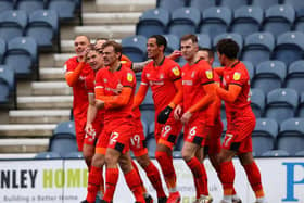 Luton's players celebrate their winner at Preston North End last season