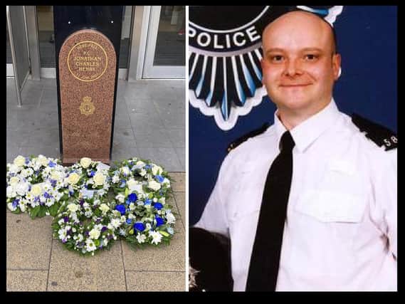 Wreaths were laid as the memorial in George Street (left) in memory of PC Jon Henry (right)