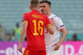 Luton midfielder Joe Morrell clashes with Xherdan Shaqiri of Switzerland