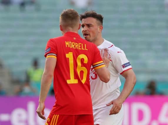 Luton midfielder Joe Morrell clashes with Xherdan Shaqiri of Switzerland