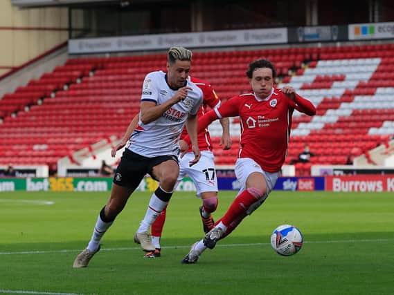 Harry Cornick tries to sprint away in Luton's opening Championship game at Barnsley last season