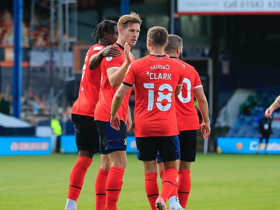 James Collins celebrates one of his 72 goals for the Hatters