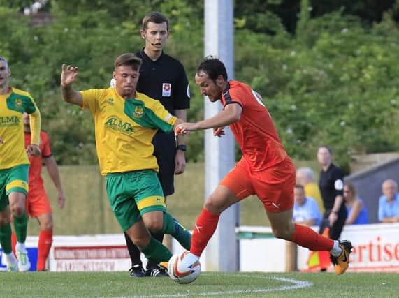 Danny Hylton gets forward against Hitchin back in the summer of 2018