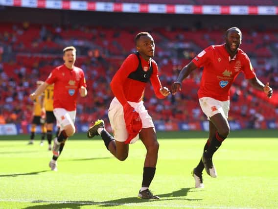 Carlos Mendes Gomes celebrates scoring the winner for Morecambe in the League Two play-off final