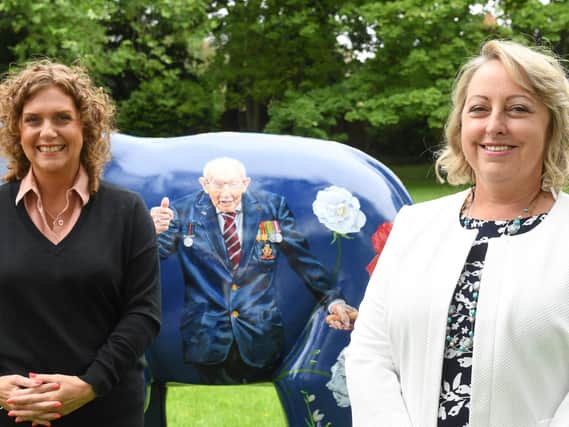 Captain Sir Tom Moore's daughter Hannah (left) and Keech CEO Liz Searle (right) with the sculpture dedicated to his memory