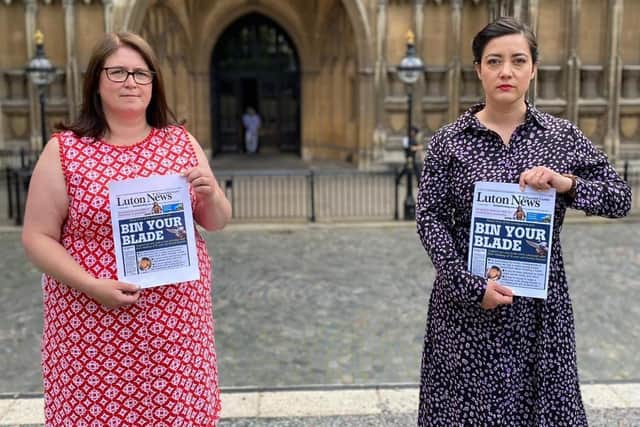 Luton South MP Rachel Hopkins, left, with Luton North MP Sarah Owen holding our front page aloft outside Parliament.