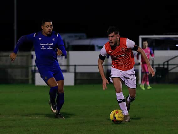 Town defender Corey Panter in action