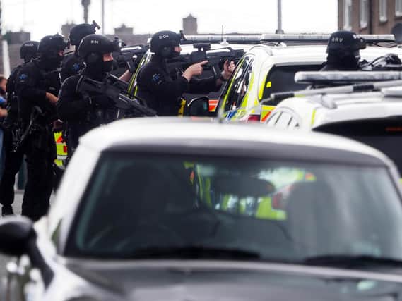 Armed police at Beadlow Road yesterday    (C:  Tony Margiocchi)
