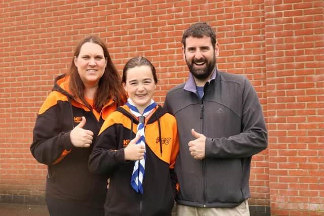 Charlotte Pound post swim with proud parents