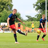 James Bree sends over a cross during Town's pre-season victory at Hitchin