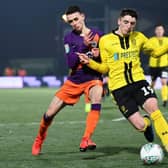 Reece Hutchinson challenges Phil Foden during Burton Albion's EFL Cup semi-final defeat to Manchester City in January 2019