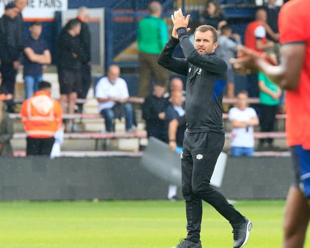 Nathan Jones applauds the Luton fans after Saturday's draw with Portsmouth (Picture: Liam Smith)