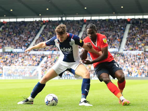 Pelly-Ruddock Mpanzu puts his opponent under pressure at the Hawthorns