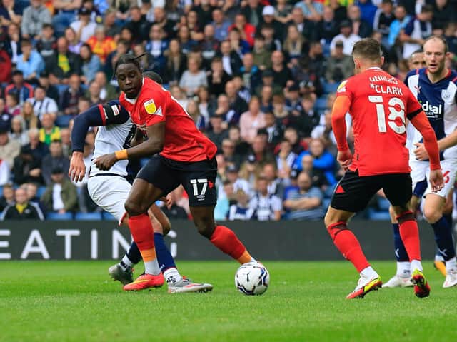 Hatters midfielder Pelly-Ruddock Mpanzu on the ball against West Bromwich Albion