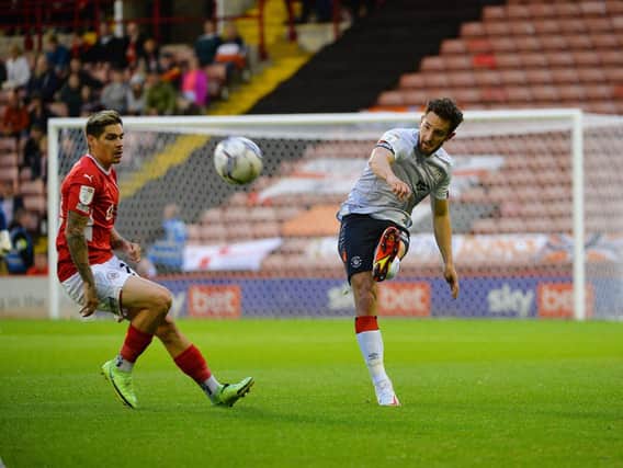 Tom Lockyer clears the danger against Barnsley in Luton's 1-0 victory