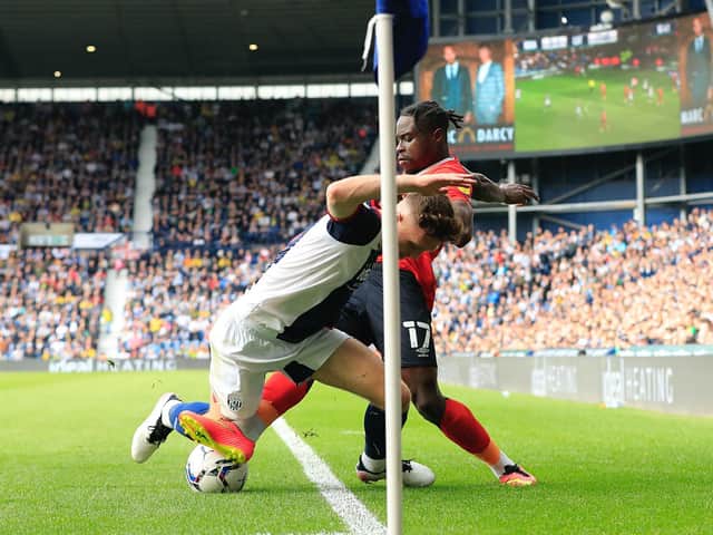 Hatters midfielder Pelly-Ruddock Mpanzu challenges for the ball against West Bromwich Albion