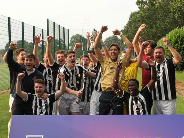 The Globe F. C. celebrate after competing in the BT Sports Pub Cup