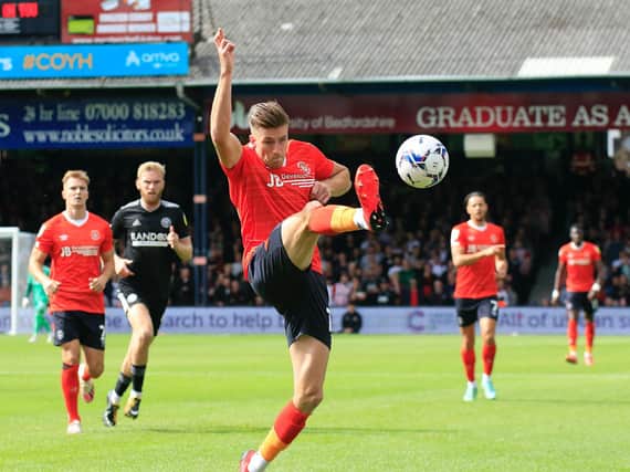 Reece Burke makes a clearance during this afternoon's goalless draw with Sheffield United