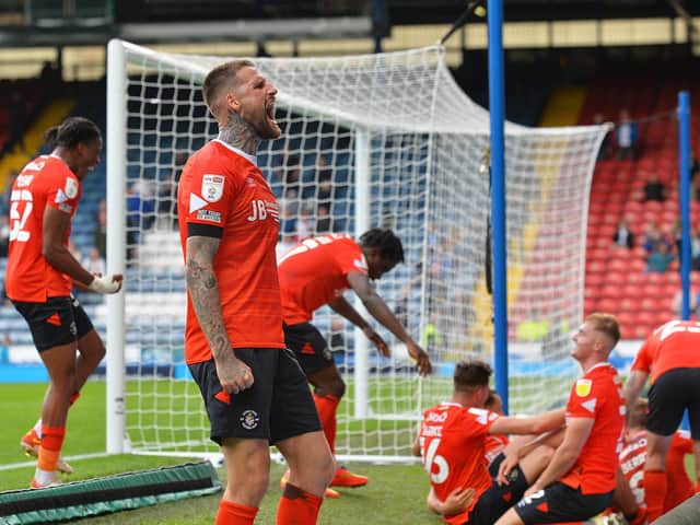 Town captain Sonny Bradley celebrates Luton's leveller with the 810 away fans at Ewood Park on Saturday