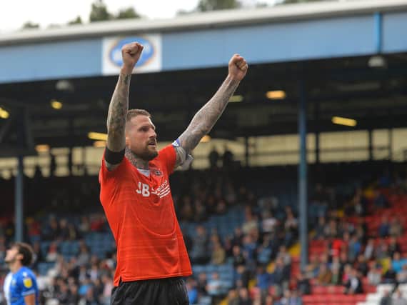 Sonny Bradley makes his first start of the season for Luton this evening