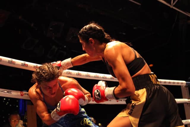 The 'Burmese Python' trades punches during her pro debut