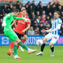Simon Sluga clears the danger against Huddersfield