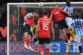 Sonny Bradley goes up for a header against Huddersfield on Saturday