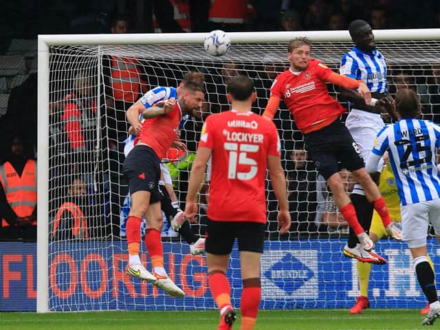 Sonny Bradley goes up for a header against Huddersfield on Saturday