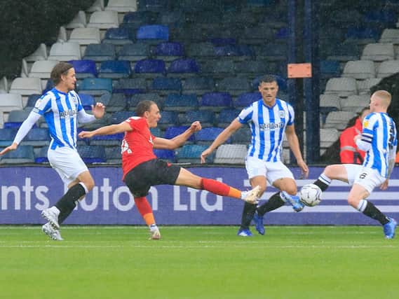 Kal Naismith looks to get a shot on goal against Huddersfield