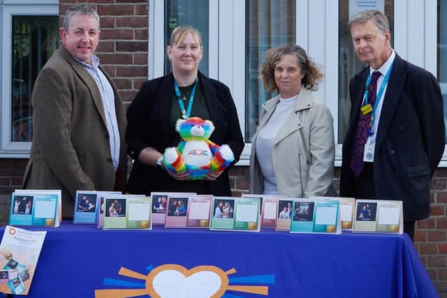 The charity calendar has now gone on sale. (L-R) David Doyle, Charmaine Norrish (Deputy Fundraising Manager Bedfordshire Hospitals Charity Team), Sue Doyle, Simon Linnett (Non Executive Chair L&D University Hospital).