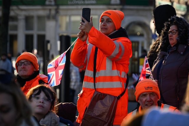 Council workers wait for the arrival of King Charles III as he visits Luton Town Hall (Photo by Leon Neal/Getty Images)