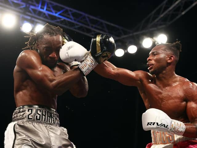 Linus Udofia lands a punch on Denzel Bentley during their British Middleweight title fight at the O2 Arena