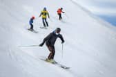 Skiers hit the slopes in the Swiss ski resort of Verbier in the Swiss Alps. (Photo by Fabrice COFFRINI / AFP via Getty Images)