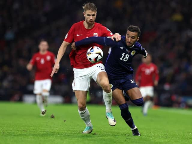 Jacob Brown tangles with Norway's Kristoffer Ajer during the 3-3 draw at Hampden Park - pic: Ian MacNicol/Getty Images