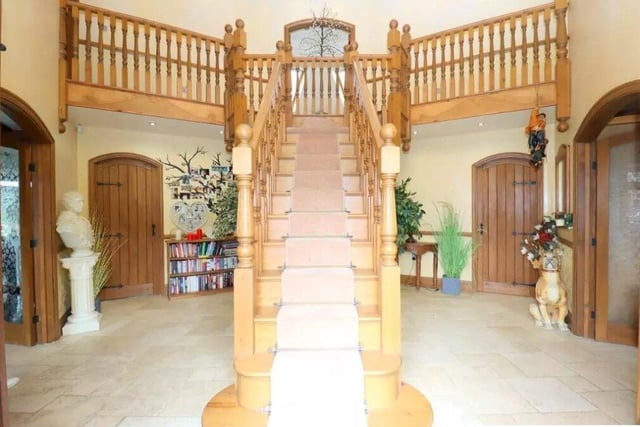 The grand entrance and oak staircase
