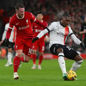 Amari'i Bell looks for a pass against Liverpool - pic: John Powell/Liverpool FC via Getty Images