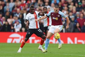 Town midfielder Marvelous Nakamba looks to win the ball back from his former Aston Villa team-mate John McGinn on Sunday - pic: Nathan Stirk/Getty Images