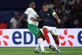 Luton attacker Chiedoze Ogbene goes up against France's Kylian Mbappe in Paris last night - pic: ANNE-CHRISTINE POUJOULAT/AFP via Getty Images