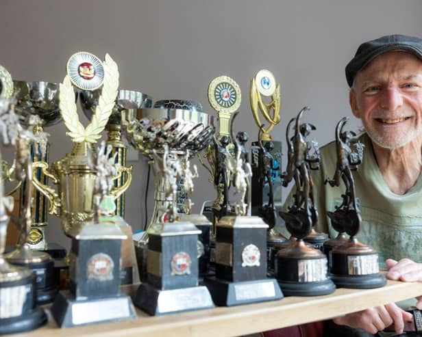 Champion Nigel Piercy pictured at home in Park House Care Home with some of his trophies