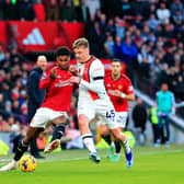 Alfie Doughty challenges Marcus Rashford during Luton's 1-0 defeat at Old Trafford in November - pic: Liam Smith